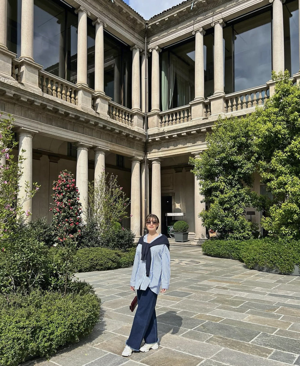 Chiara Caremoli in a palazzo courtyard in Milan